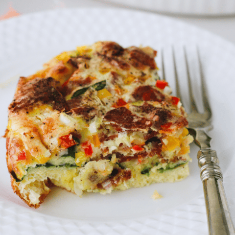 Close-up of a hearty slice of Spinach and Feta Egg Bake.
