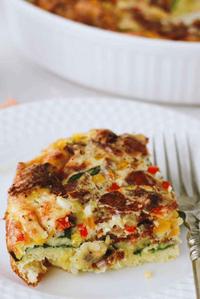 Close-up of a hearty slice of Spinach and Feta Egg Bake.